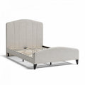 Upholstered queen size bed frame with wooden slats and curved headboard